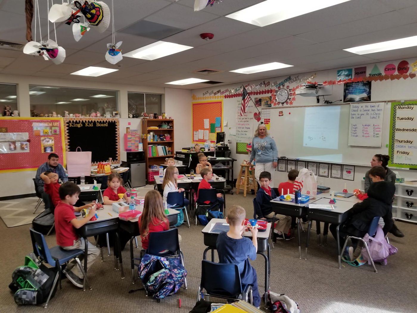 Teacher leading a classroom holiday activity