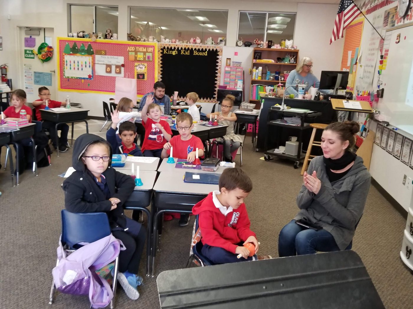 Teacher leading a classroom holiday activity