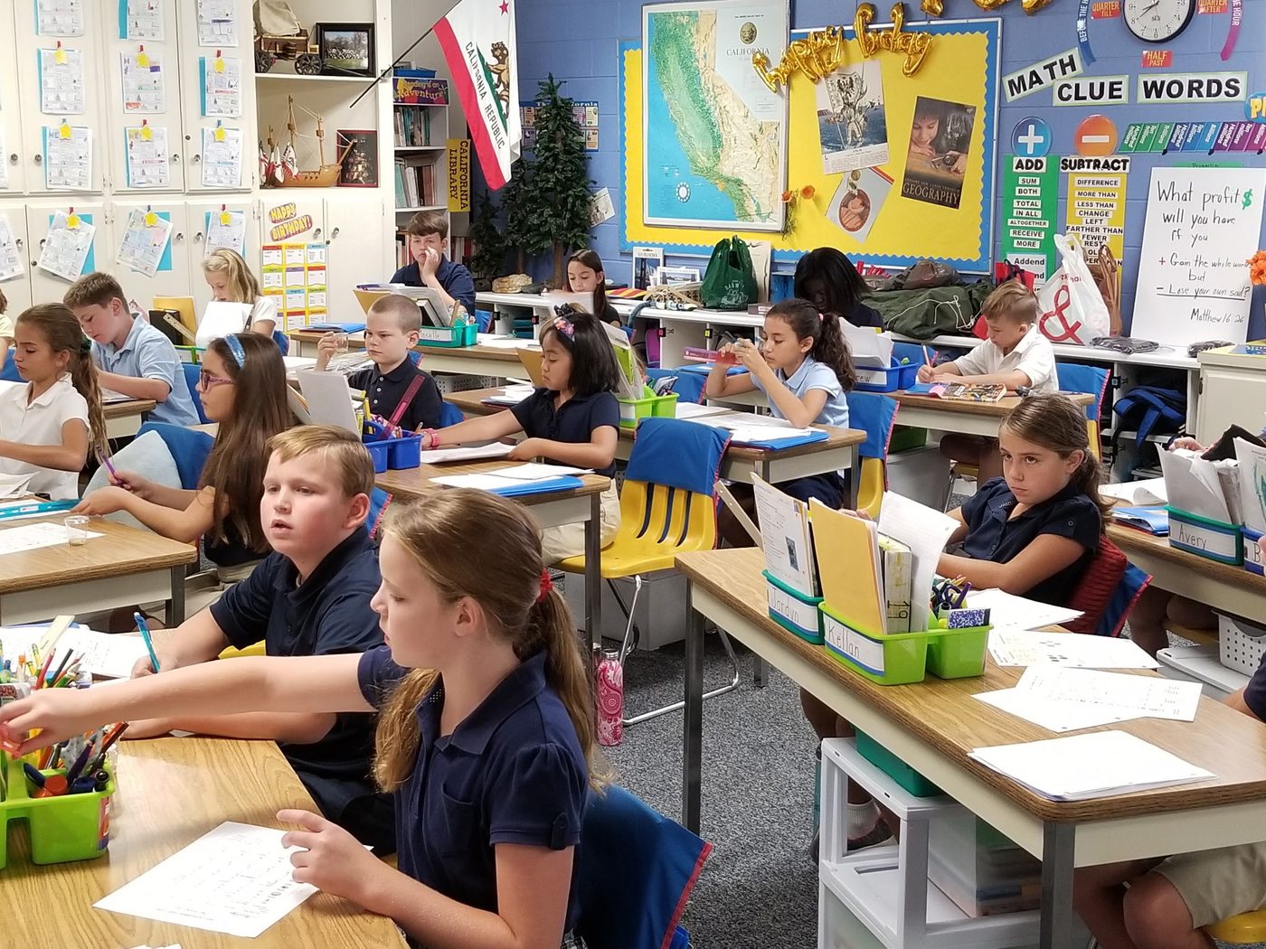 Students at a classroom activity table