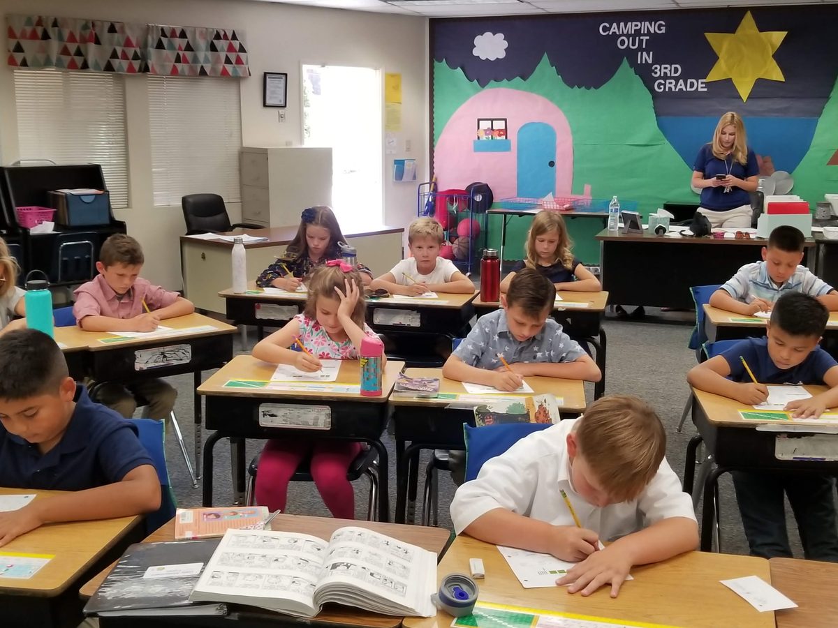 Students working at their desks in class